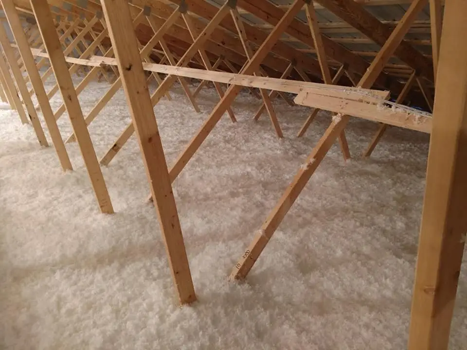 Blown-in insulation across an attic floor